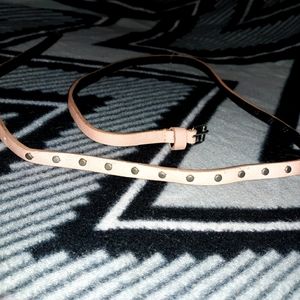 Pale pink skinny belt with silver studs